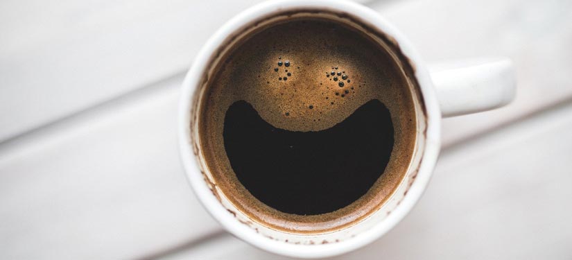 Coffee mug featuring a smile in the foam