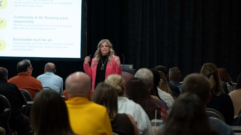 Presenter Tina Miller shares about AI with #HEWeb24 attendees